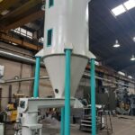 Powder material tank with pneumatic bag holder